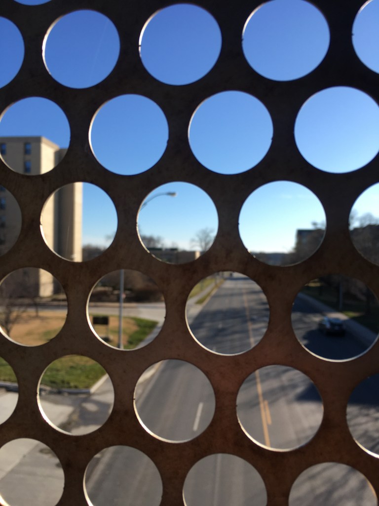 Street view through fence.