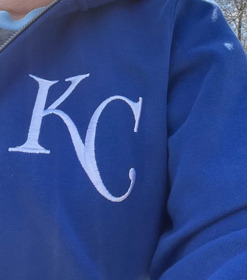 A Royals baseball emblem -- "KC" -- on blue hoodie