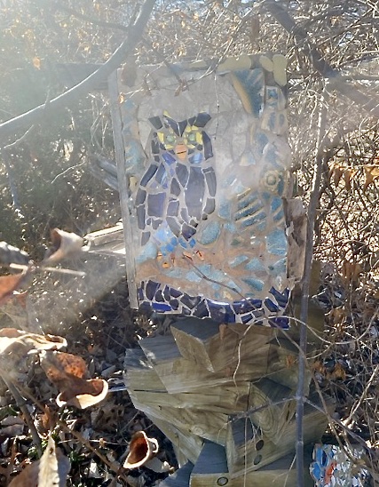 Colorful mosaic of an owl, sitting outdoors