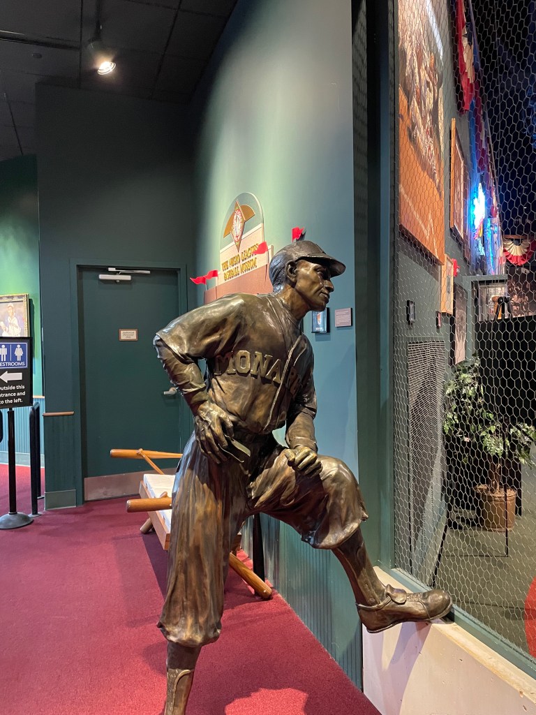 Statue of Buck O'Neil in a Monarchs uniform