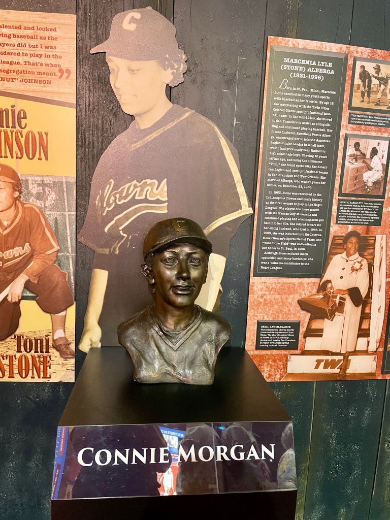 Bust of baseball player Connie Morgan in front of cutout image of her.