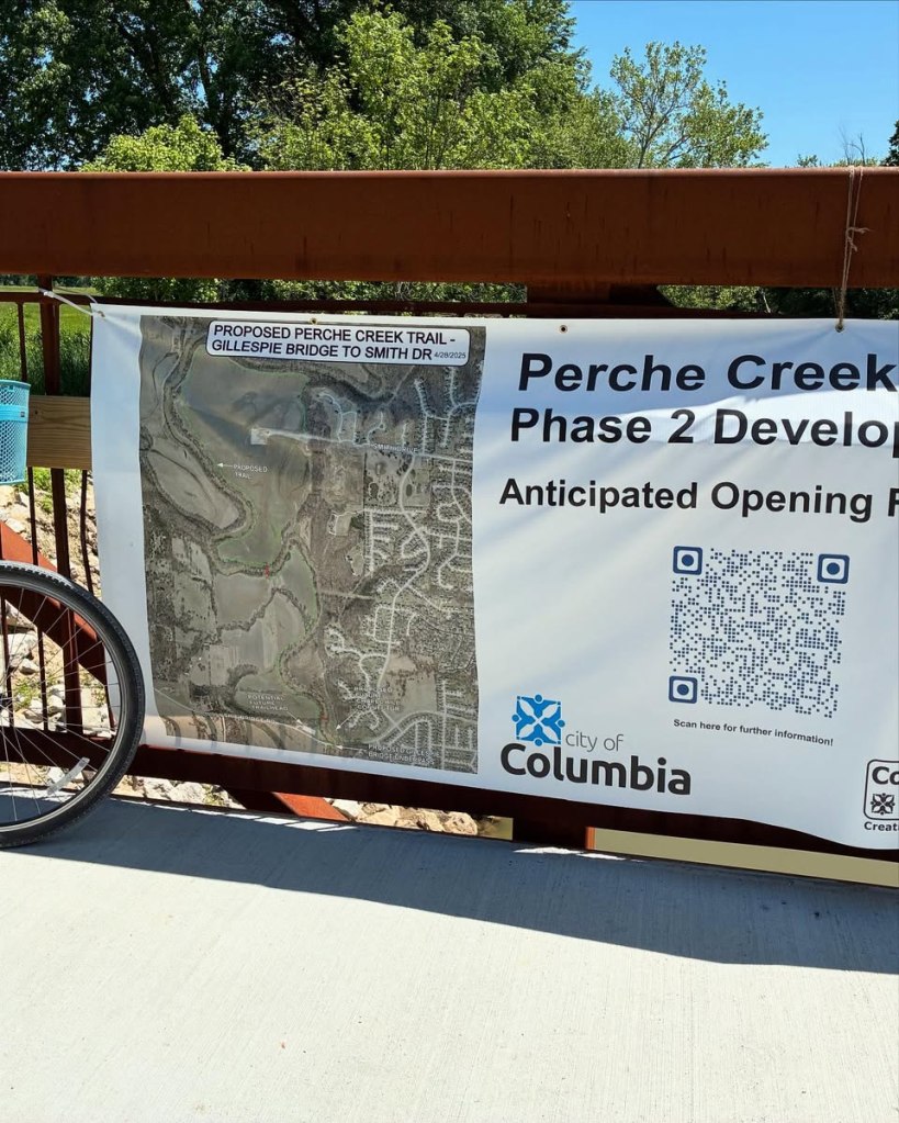Sign on bridge: "Perche Creek Phase 2 Development.