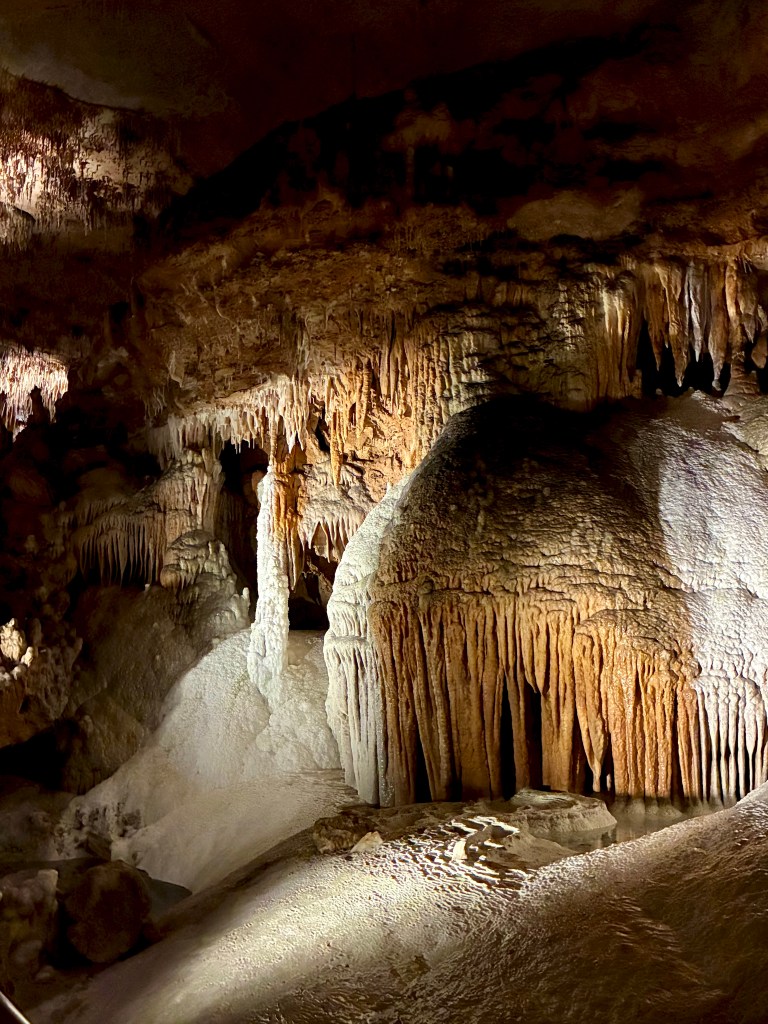 multi-colored cave formations that look like fringed curtains