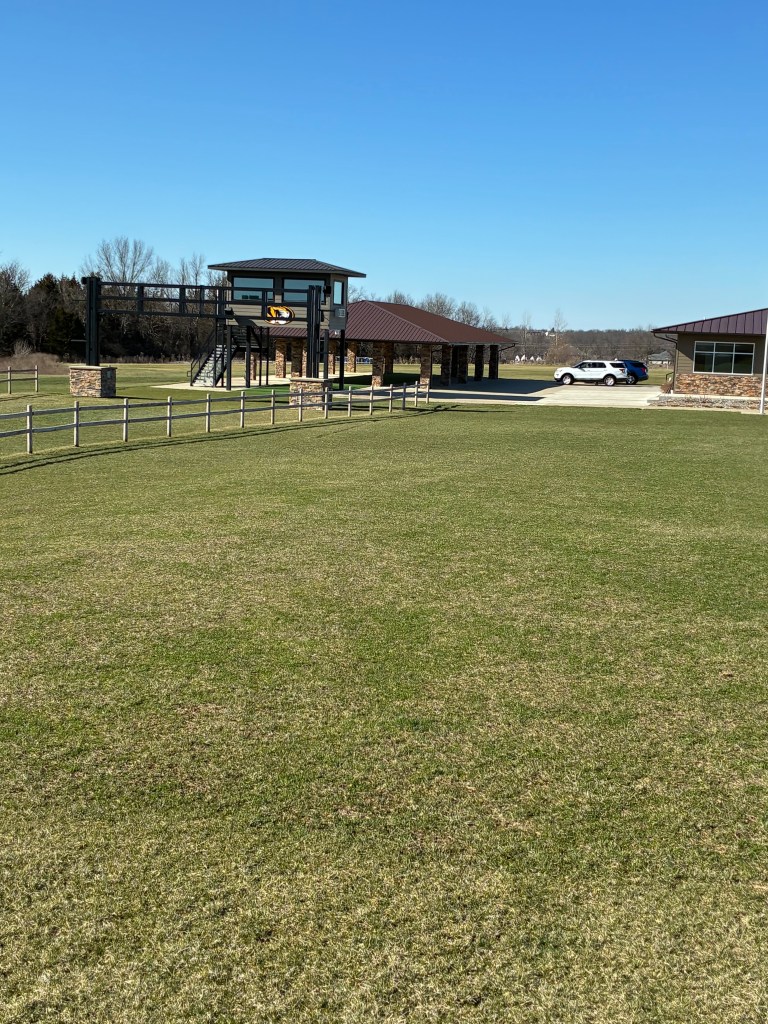 Shelter house and observation structure at beginning of cross country grass track.
