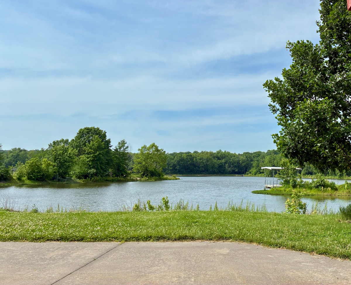 Lake under moderately cloudy sky.