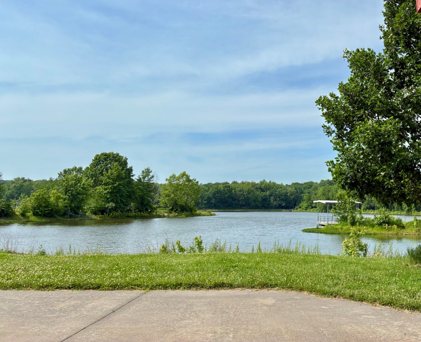 Lake under moderately cloudy sky.